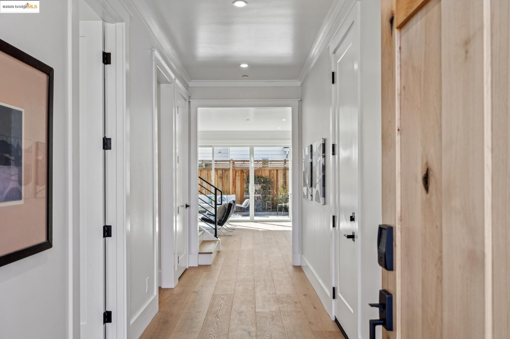 2310 Eighth Street Berkeley, CA 94710 - Photo 7 of 44 a view of a hallway with wooden floor and a living room