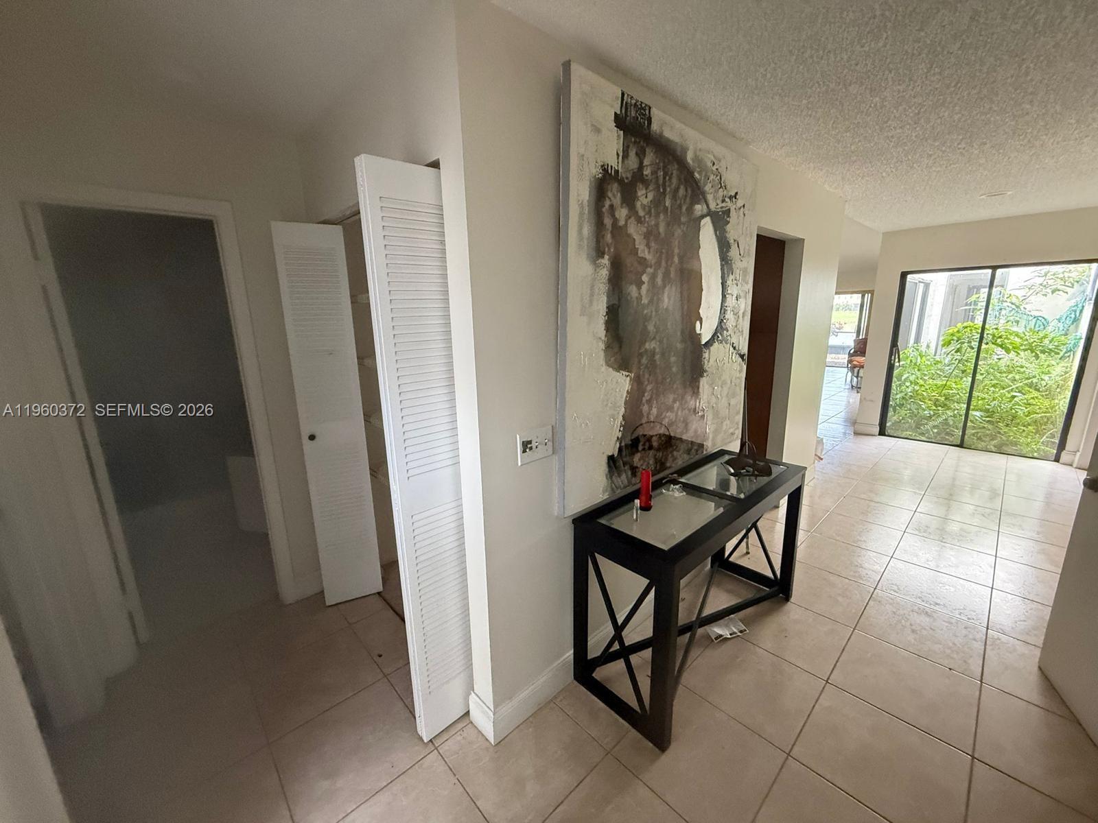 5223 Gate Lake Road, Unit 5223 Tamarac, FL 33319 - Photo 10 of 12 a room with furniture and a window