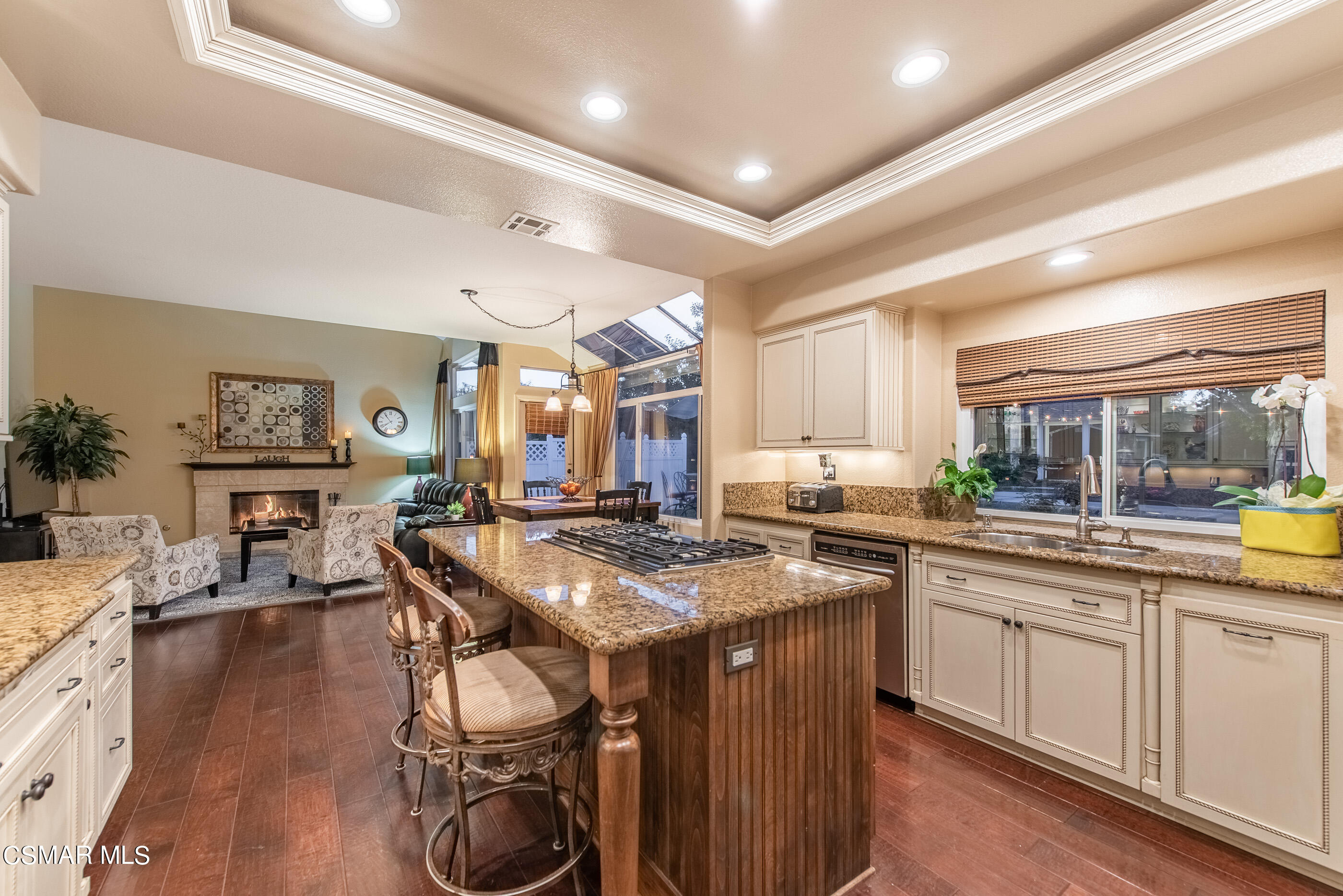 116 Valley Gate Road Simi Valley, CA 93065 - Photo 20 of 59 a kitchen with stainless steel appliances granite countertop a stove a sink dishwasher and cabinets with wooden floor
