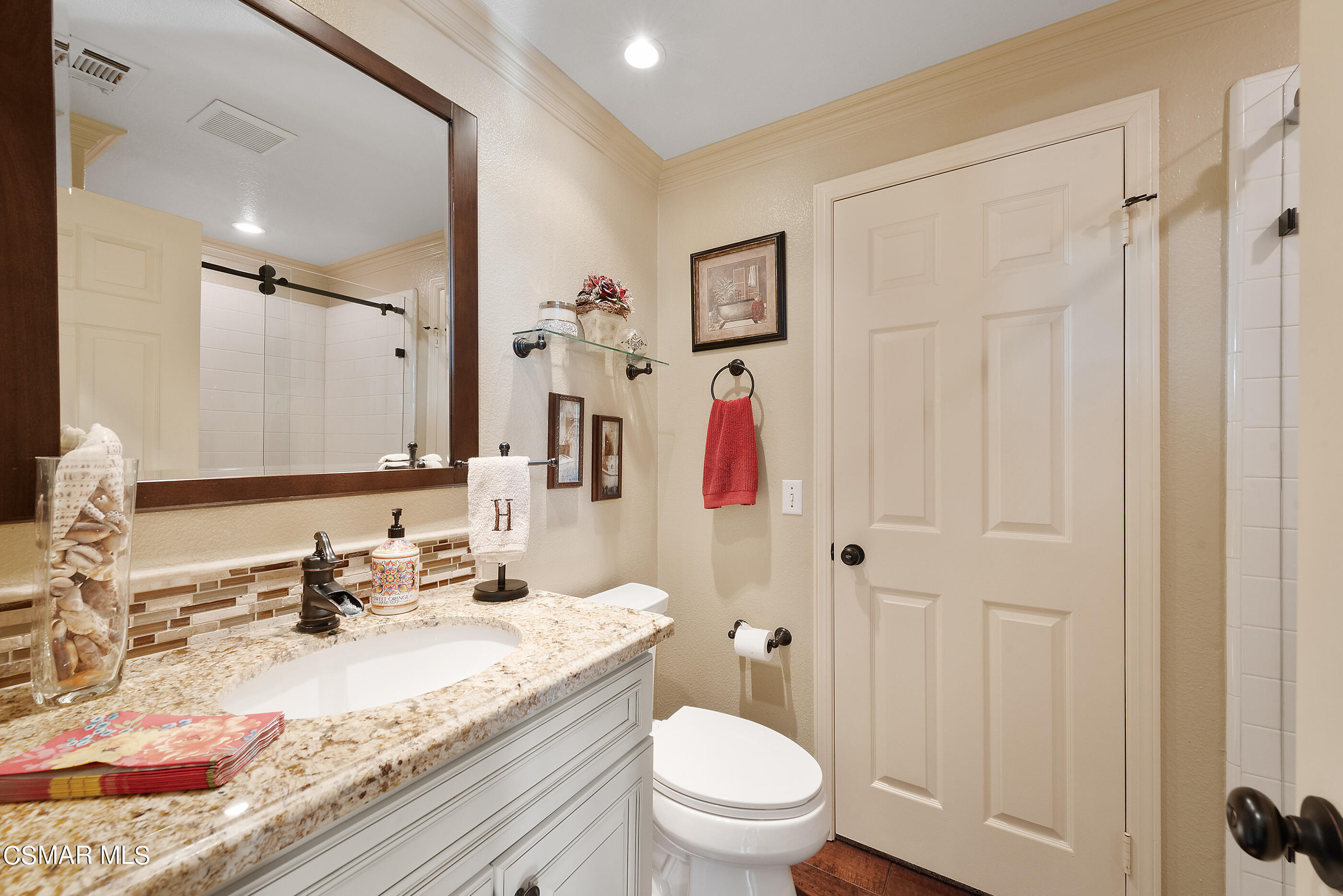 116 Valley Gate Road Simi Valley, CA 93065 - Photo 22 of 59 a bathroom with a granite countertop sink and a mirror