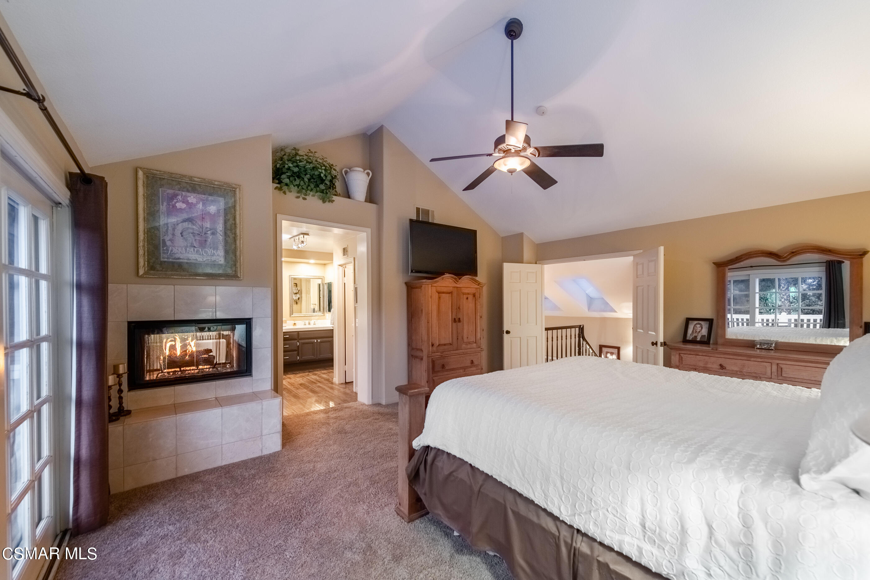 116 Valley Gate Road Simi Valley, CA 93065 - Photo 24 of 59 a bedroom with a bed ceiling fan and a fireplace