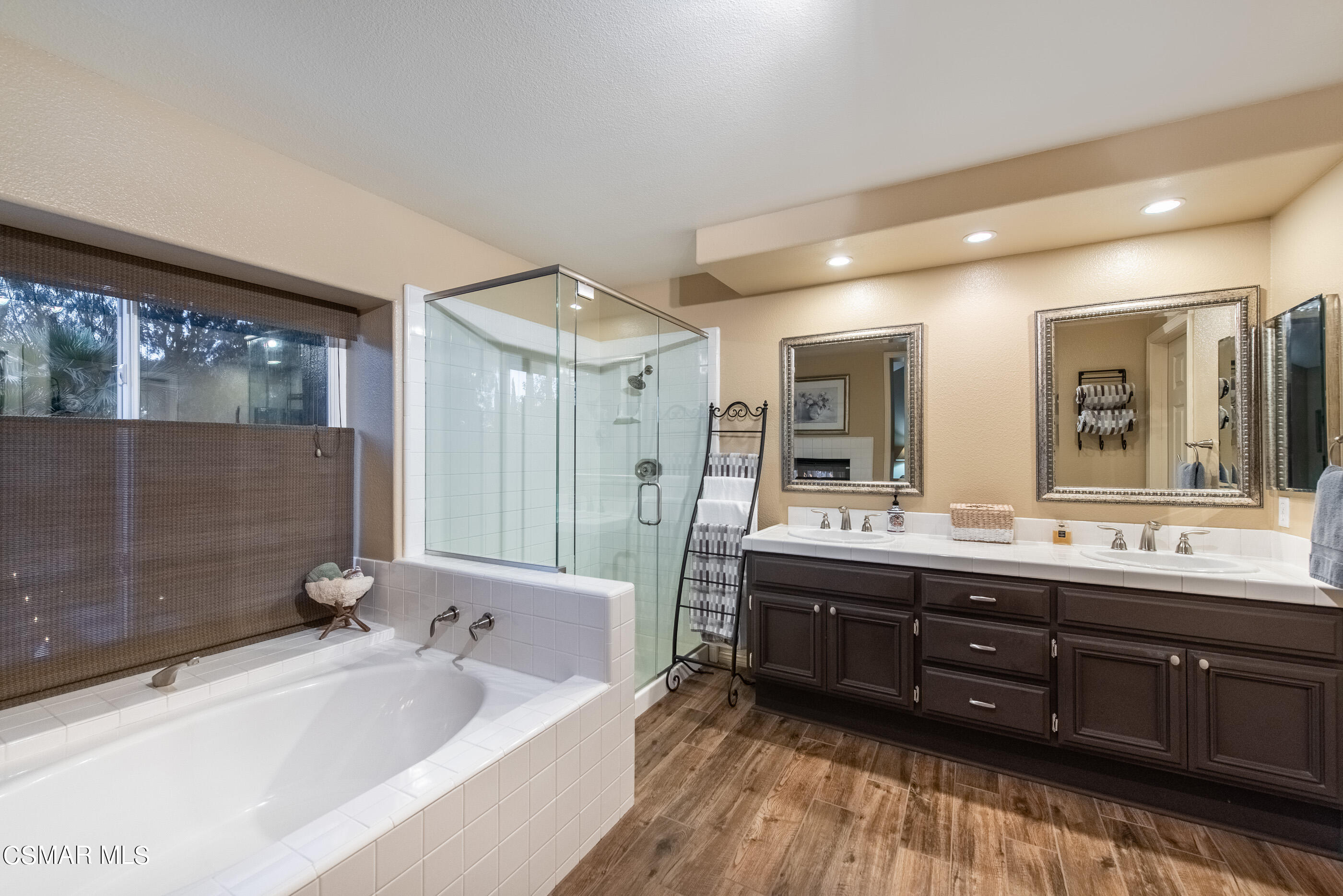 116 Valley Gate Road Simi Valley, CA 93065 - Photo 25 of 59 a bathroom with a tub sink shower and mirror