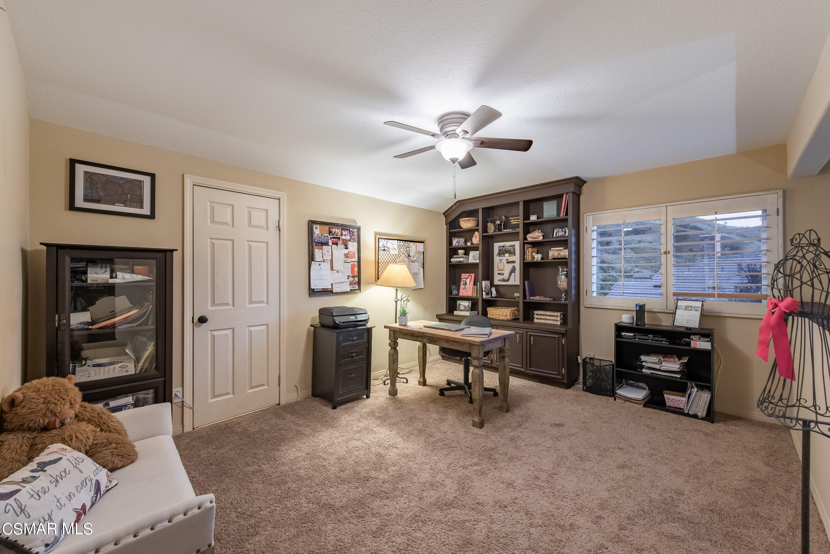 116 Valley Gate Road Simi Valley, CA 93065 - Photo 32 of 59 a view of a livingroom with workspace and a couch