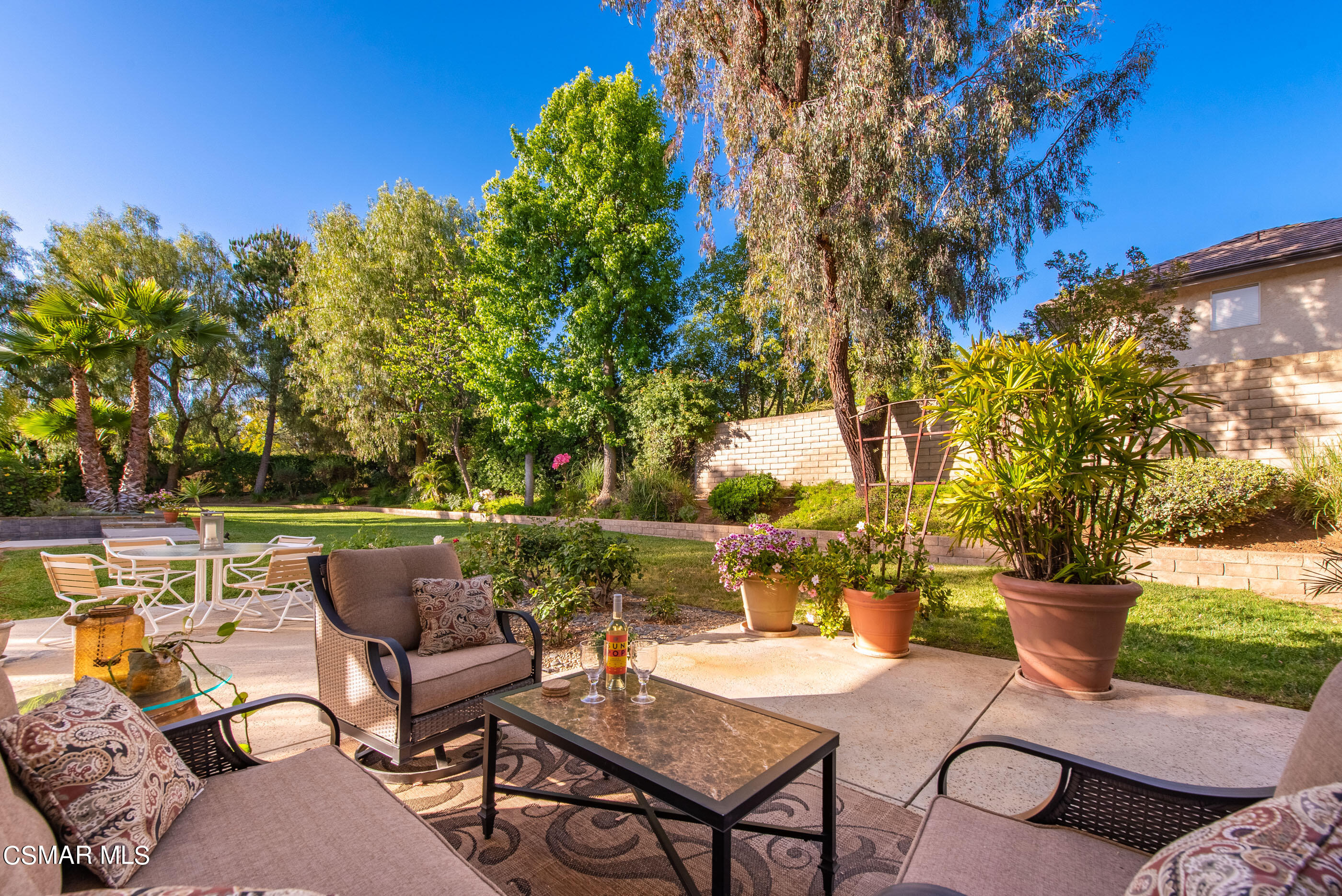 116 Valley Gate Road Simi Valley, CA 93065 - Photo 33 of 59 a view of a patio with couches table and chairs and potted plants