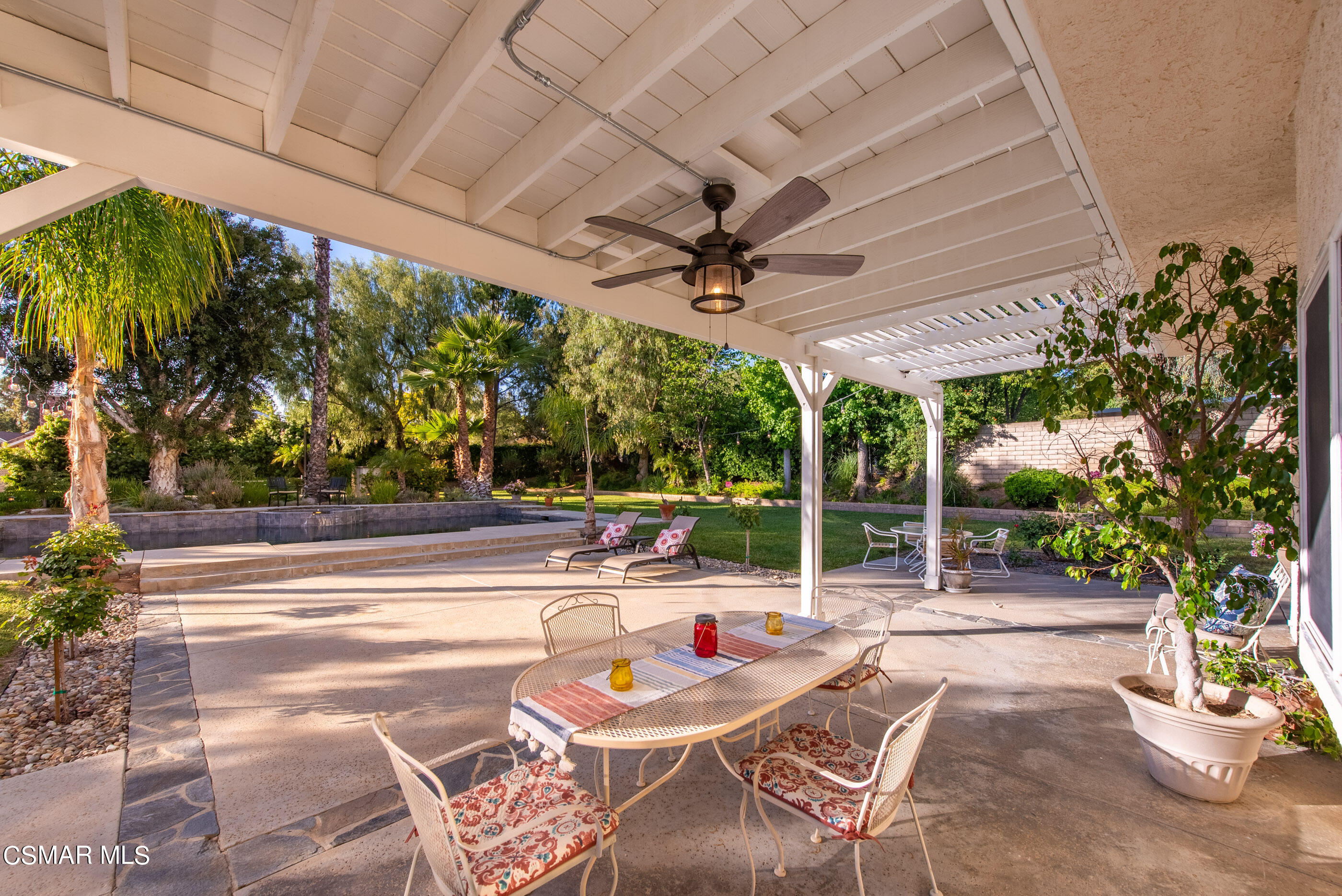116 Valley Gate Road Simi Valley, CA 93065 - Photo 36 of 59 a patio with a table and chairs and a barbeque