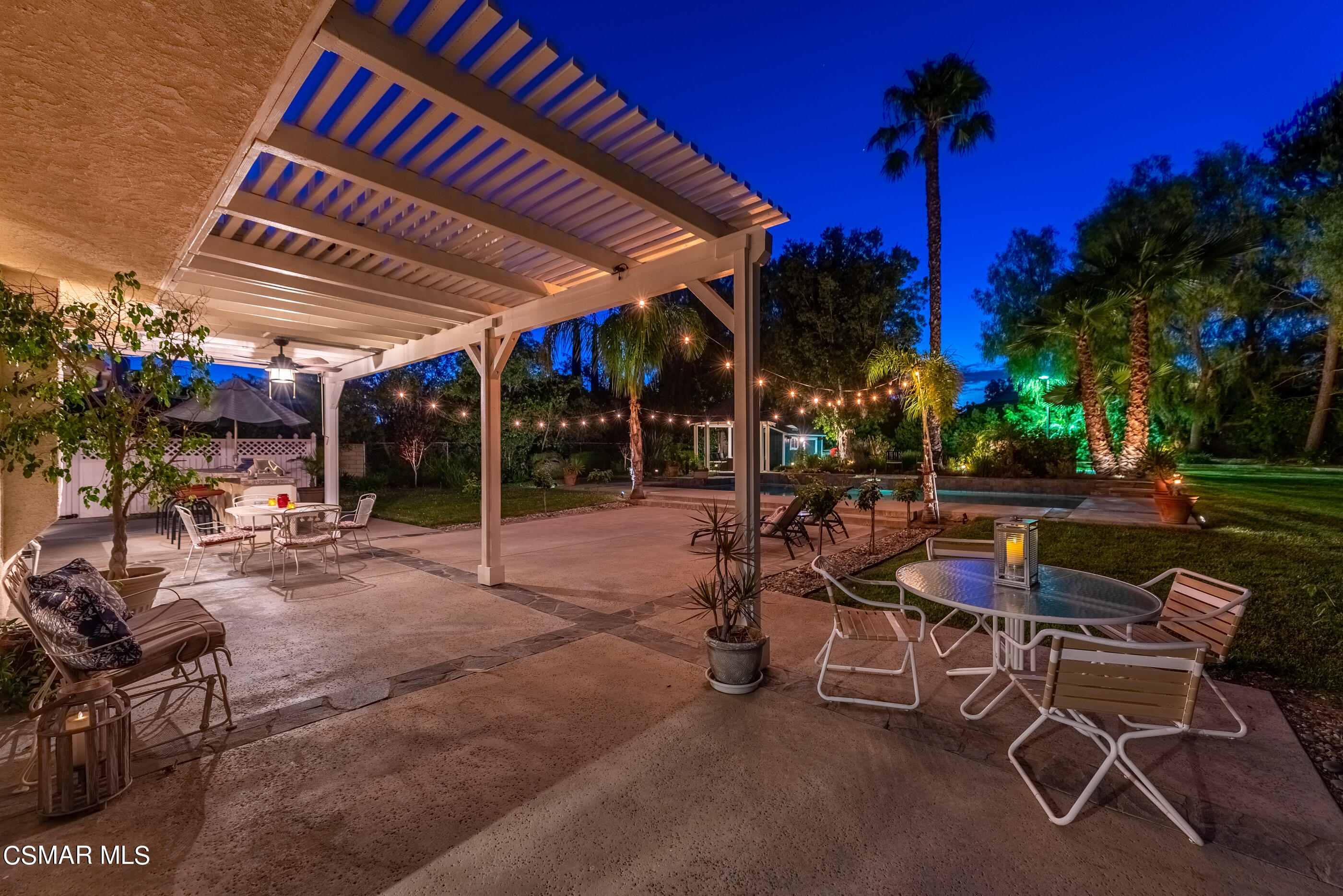 116 Valley Gate Road Simi Valley, CA 93065 - Photo 43 of 59 a view of a patio with a table and chairs under an umbrella
