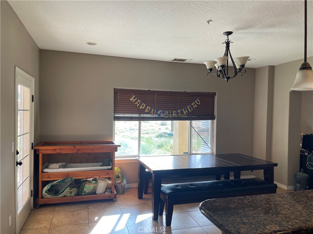 7677 Mono Road Phelan, CA 92371 - Photo 5 of 16 a living room with furniture and a window