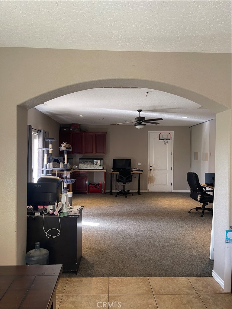 7677 Mono Road Phelan, CA 92371 - Photo 6 of 16 a living room with furniture and a chandelier