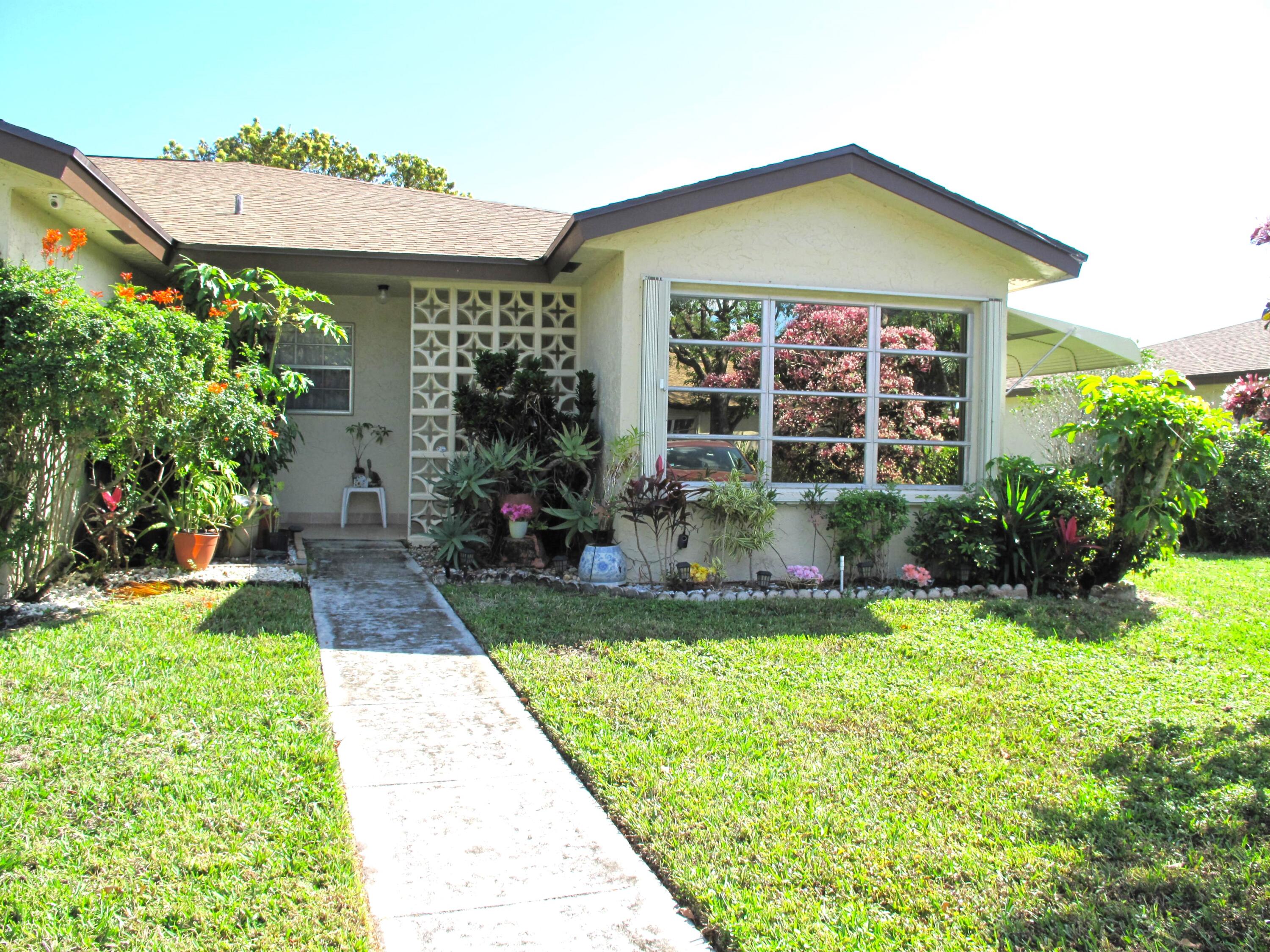 5220 Nesting Way, Unit D Delray Beach, FL 33484 - Photo 1 of 40 Front view of Corner villa