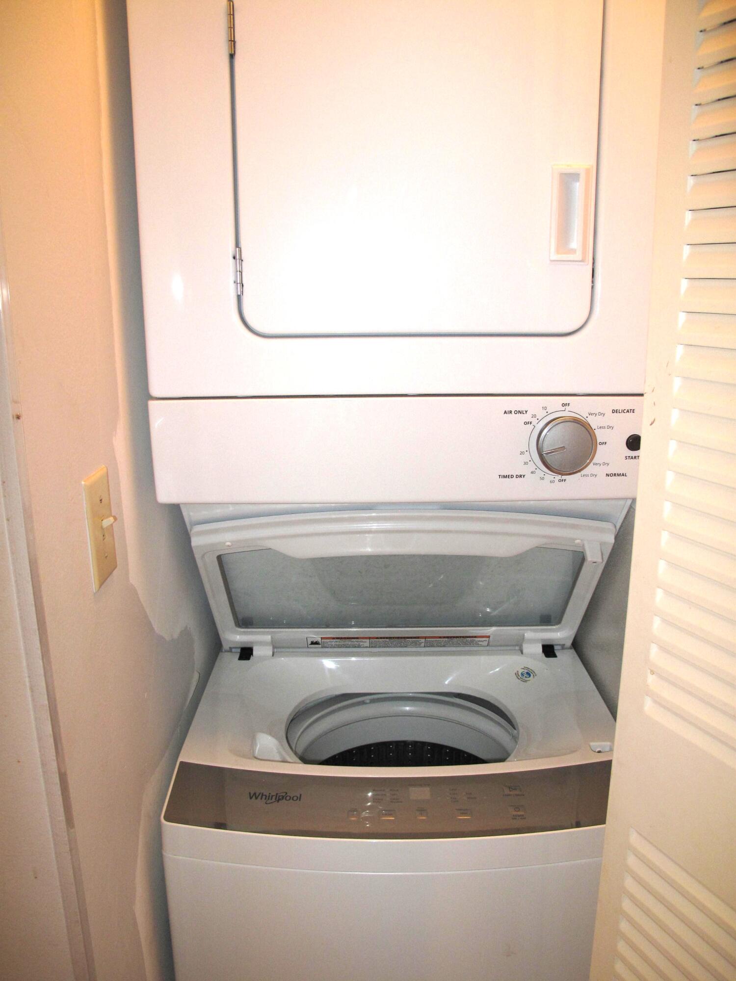 5220 Nesting Way, Unit D Delray Beach, FL 33484 - Photo 13 of 40 Washer and dryer inside