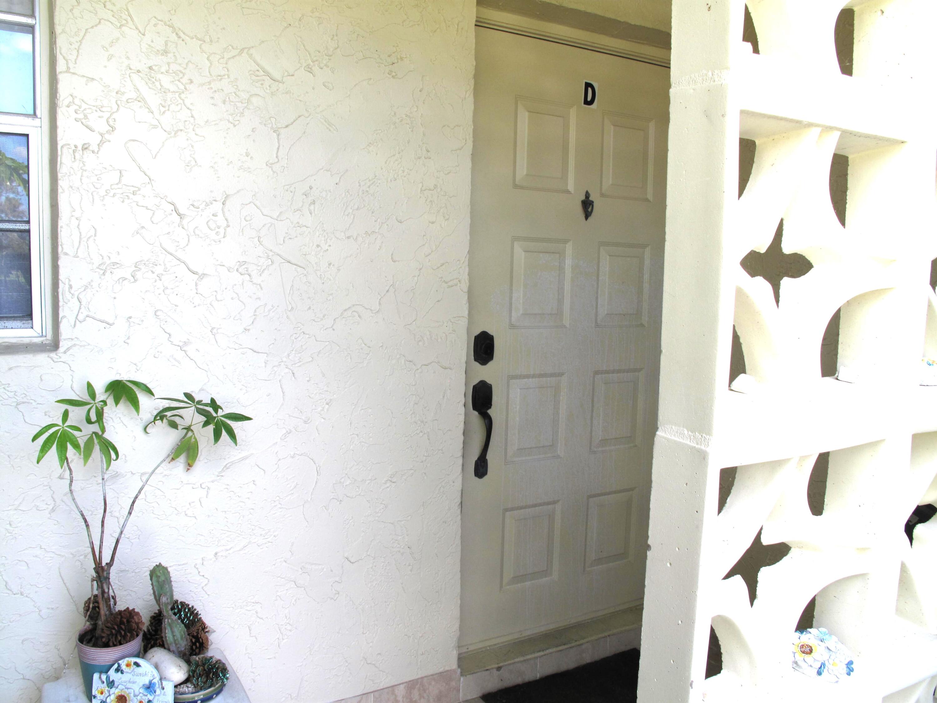 5220 Nesting Way, Unit D Delray Beach, FL 33484 - Photo 2 of 40 Entrance to villa