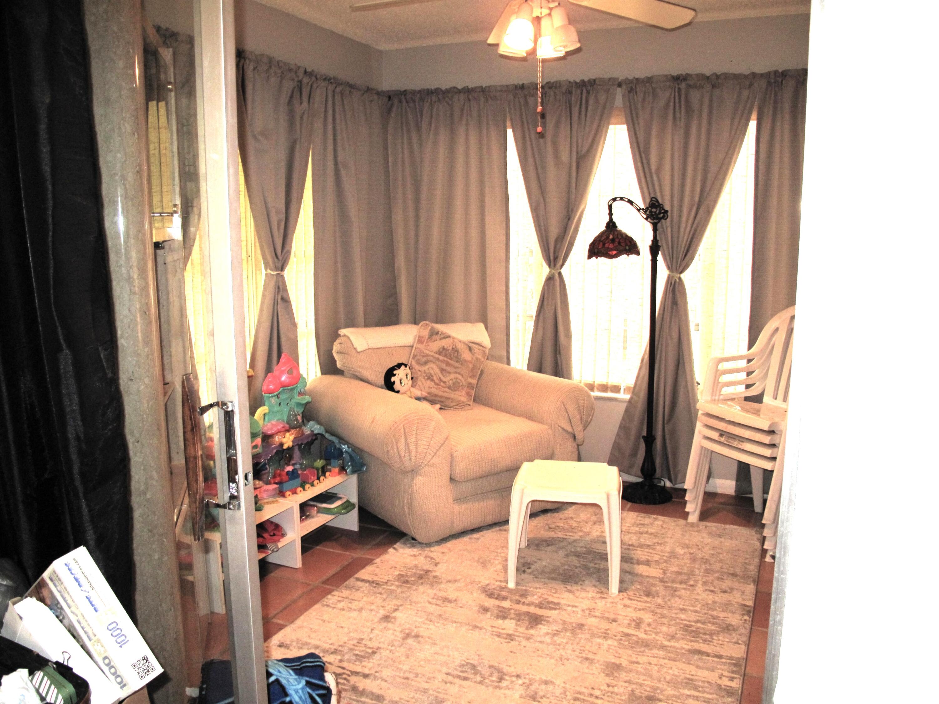 5220 Nesting Way, Unit D Delray Beach, FL 33484 - Photo 3 of 40 Enclosed Florida room (2)