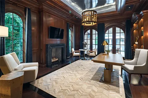 a view of a livingroom with furniture window and wooden floor