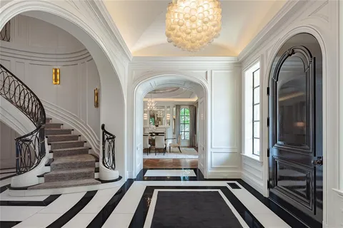 a view of a entryway door of the house with wooden floor