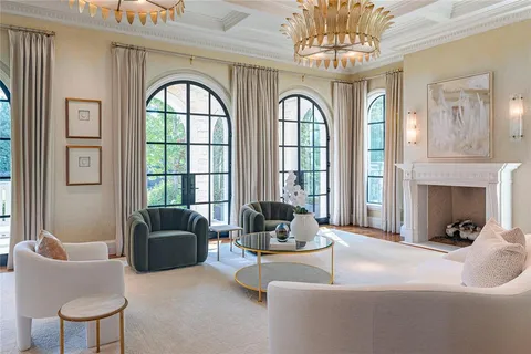 a living room with furniture or chandelier and a fireplace