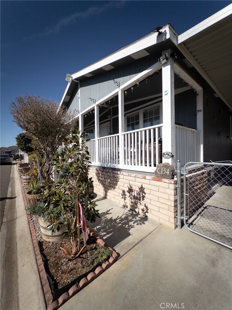 20843 Waalew Road Apple Valley, CA 92307 - Photo 13 of 32 a view of a house with a wooden fence