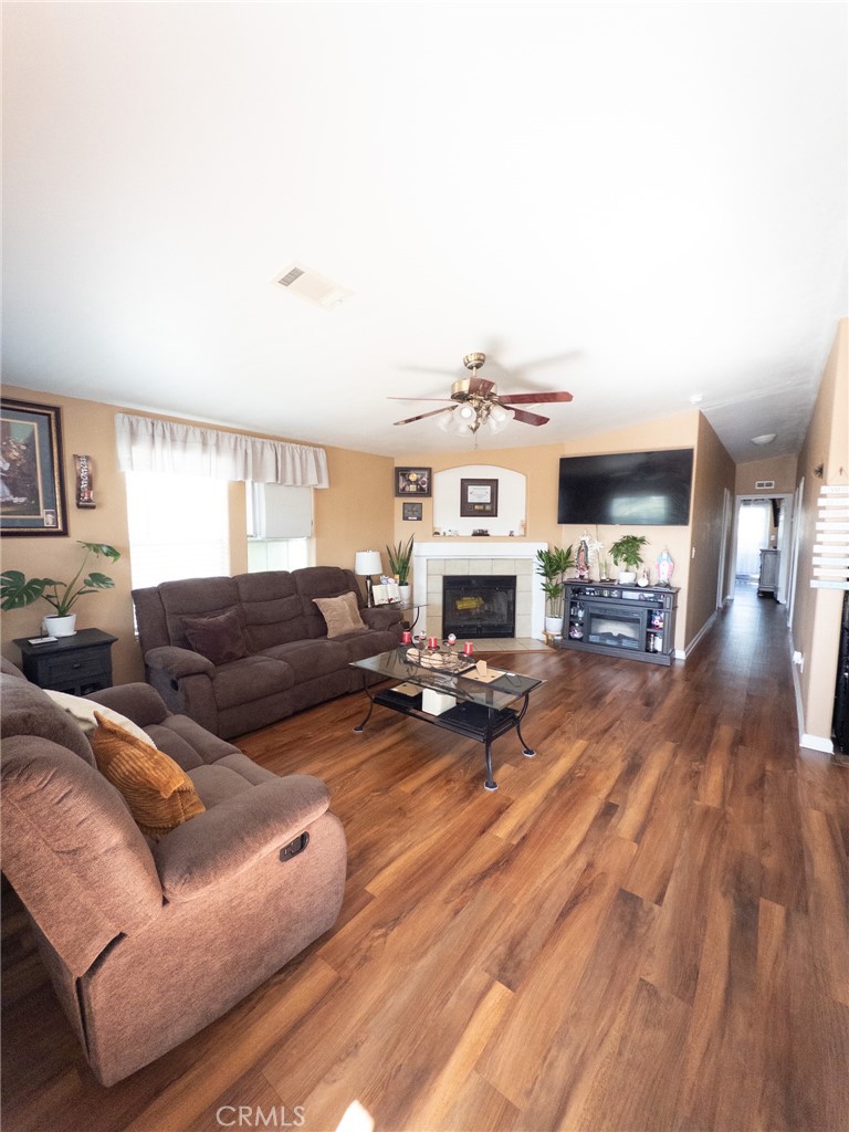 20843 Waalew Road Apple Valley, CA 92307 - Photo 17 of 32 a living room with furniture and a fireplace