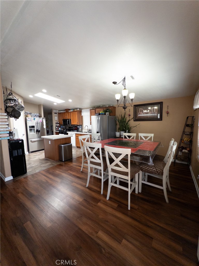 20843 Waalew Road Apple Valley, CA 92307 - Photo 18 of 32 a view of a dining room with furniture and wooden floor