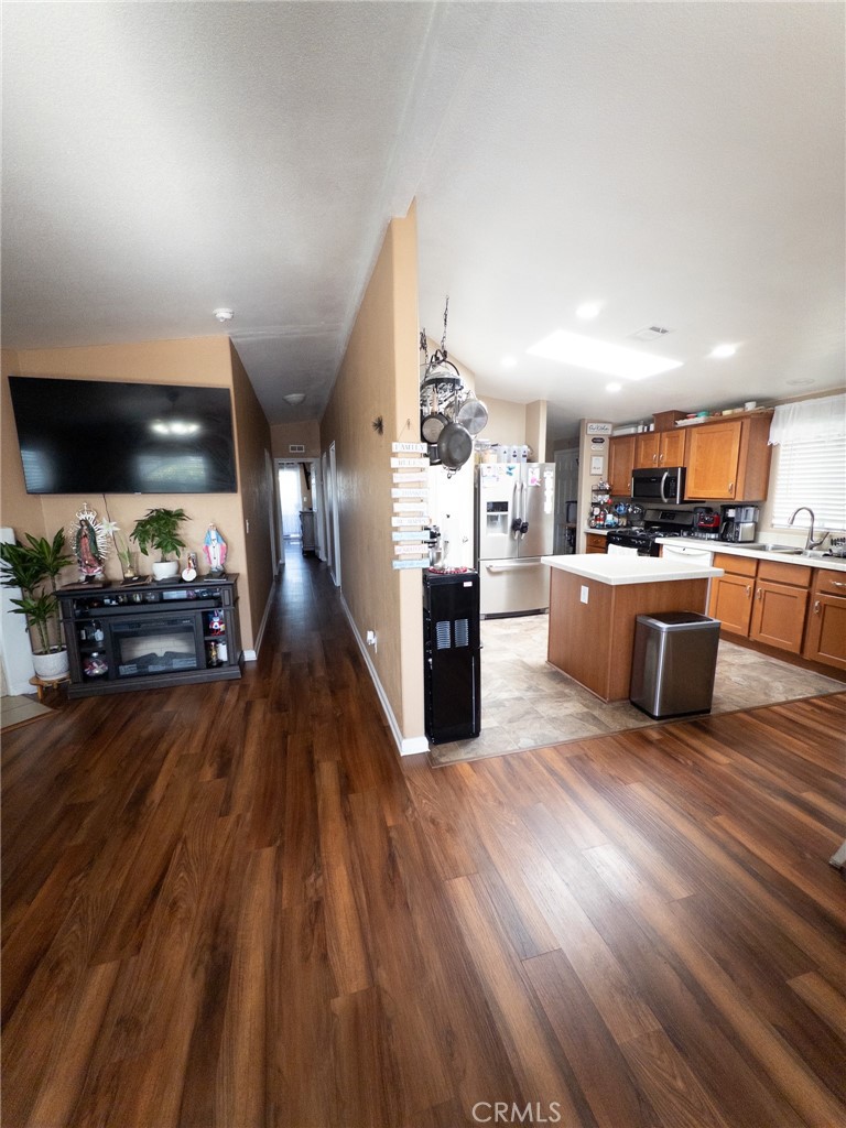 20843 Waalew Road Apple Valley, CA 92307 - Photo 19 of 32 a view of a kitchen with furniture and wooden floor
