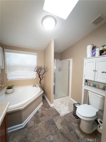 a kitchen with stainless steel appliances granite countertop a stove and a refrigerator