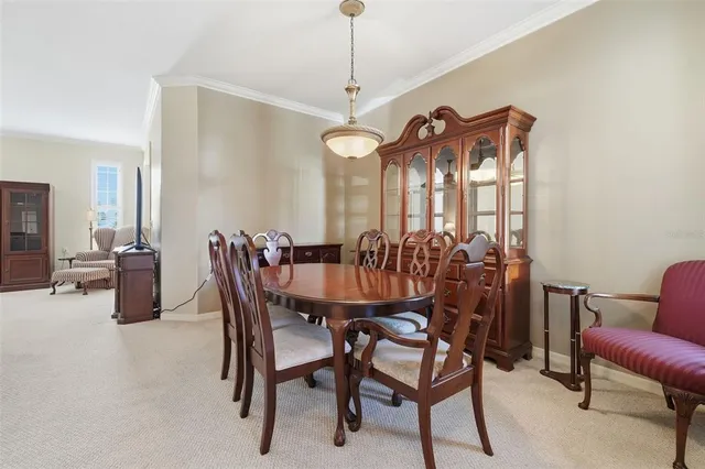 a dining room with furniture and window