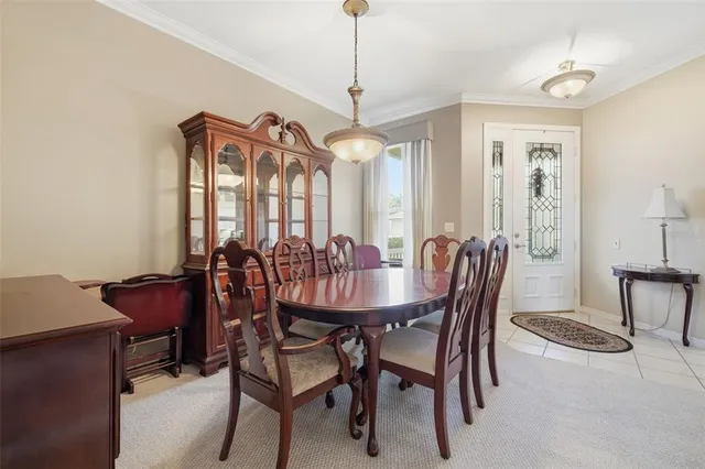 a view of a dining room with furniture and window
