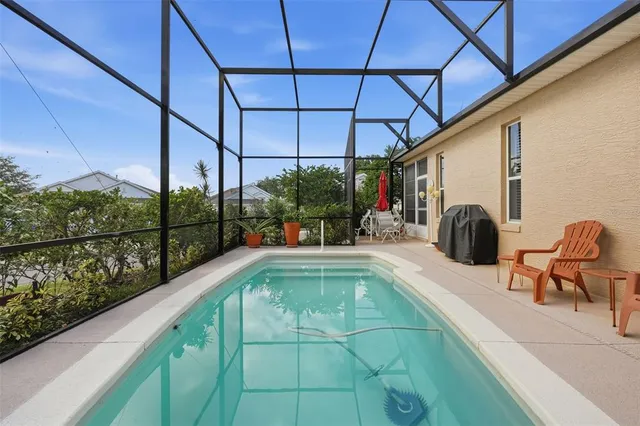 a view of a swimming pool with a patio