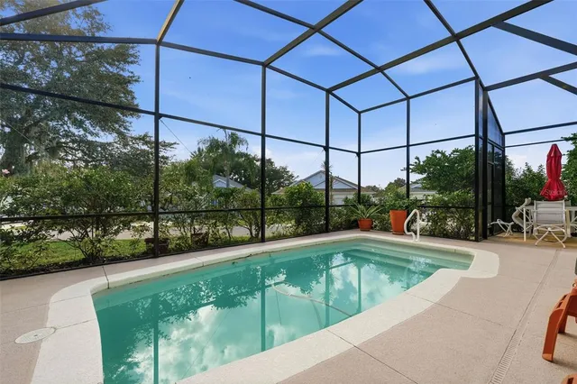 a view of a swimming pool with a patio