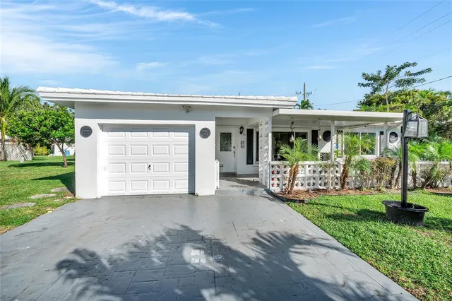 a front view of a house with a yard and porch