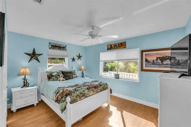 a bedroom with bed and window