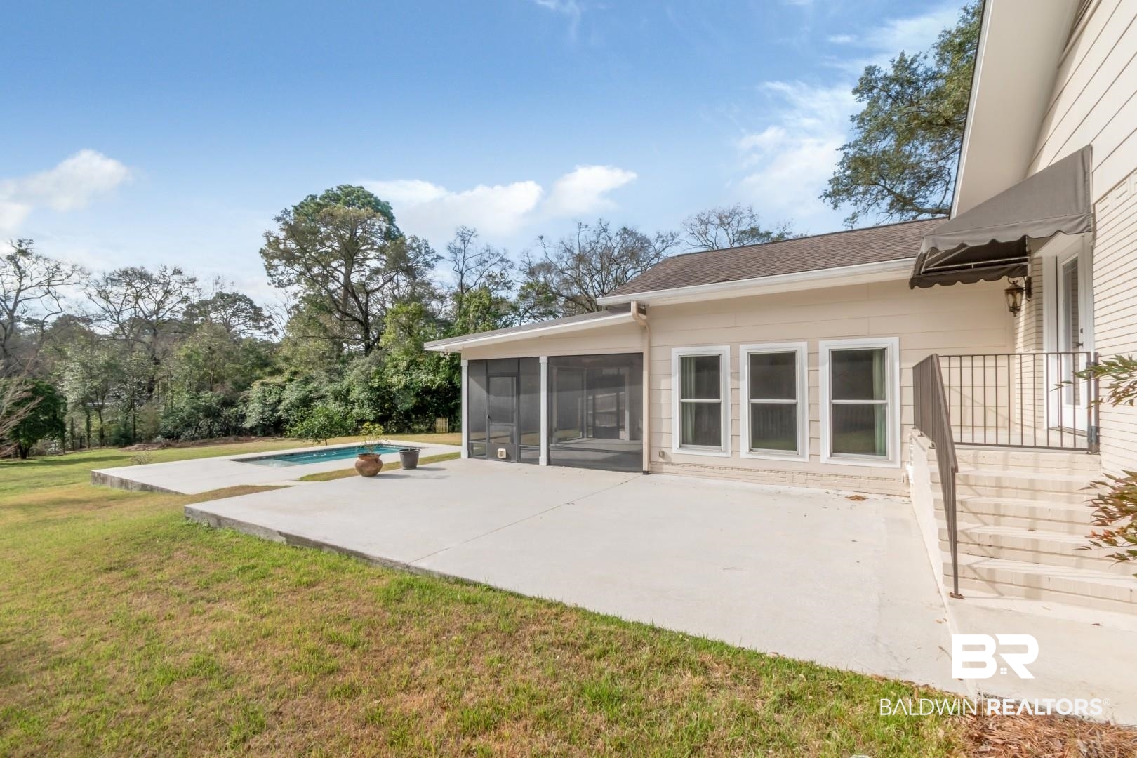 231 Rochester Road Mobile, AL 36608 - Photo 41 of 51 View of patio / terrace with an outdoor pool and a sunroom