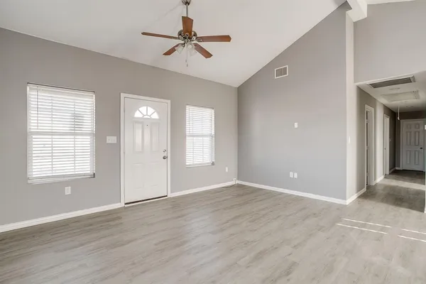a view of an empty room with a window