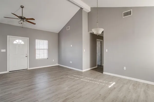 a view of an empty room with a window