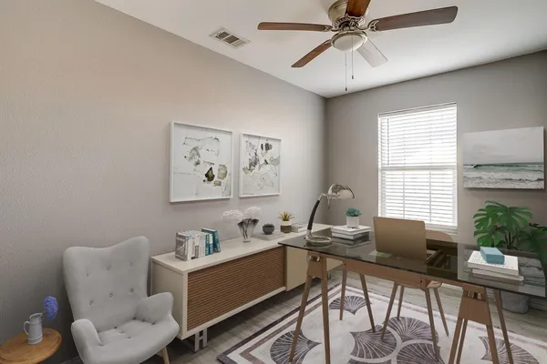 a workspace with furniture and window