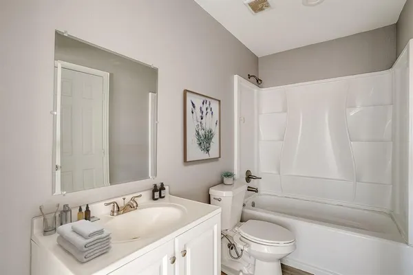 a bathroom with a sink a toilet and a bathtub