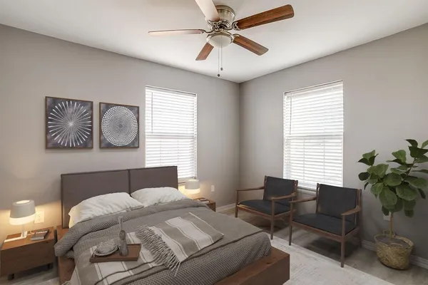 a bedroom with a bed and a couch