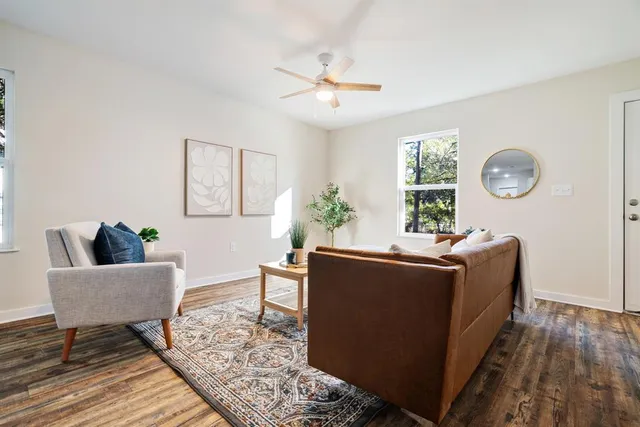 a living room with furniture and a window