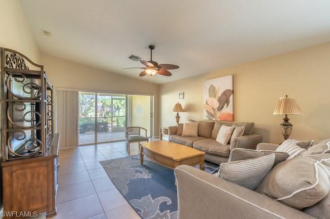 8623 Erice Court Naples, FL 34114 - Photo 15 of 37 a living room with furniture and a large window