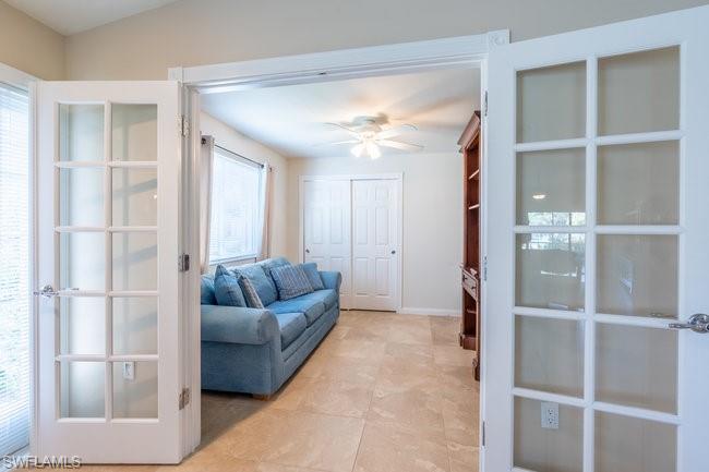 8623 Erice Court Naples, FL 34114 - Photo 23 of 37 a living room with furniture and a window