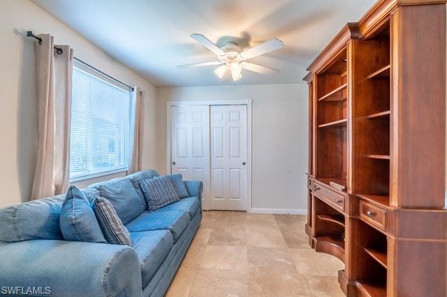 8623 Erice Court Naples, FL 34114 - Photo 24 of 37 a living room with furniture and a window
