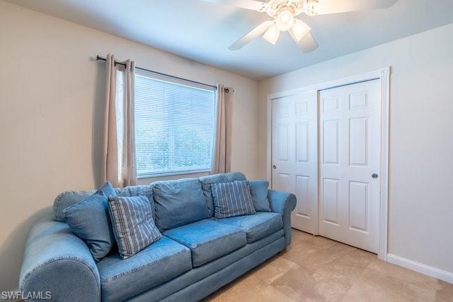 8623 Erice Court Naples, FL 34114 - Photo 25 of 37 a living room with furniture and a window