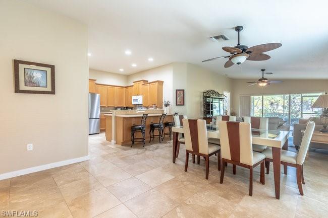 8623 Erice Court Naples, FL 34114 - Photo 7 of 37 a view of a dining room with furniture