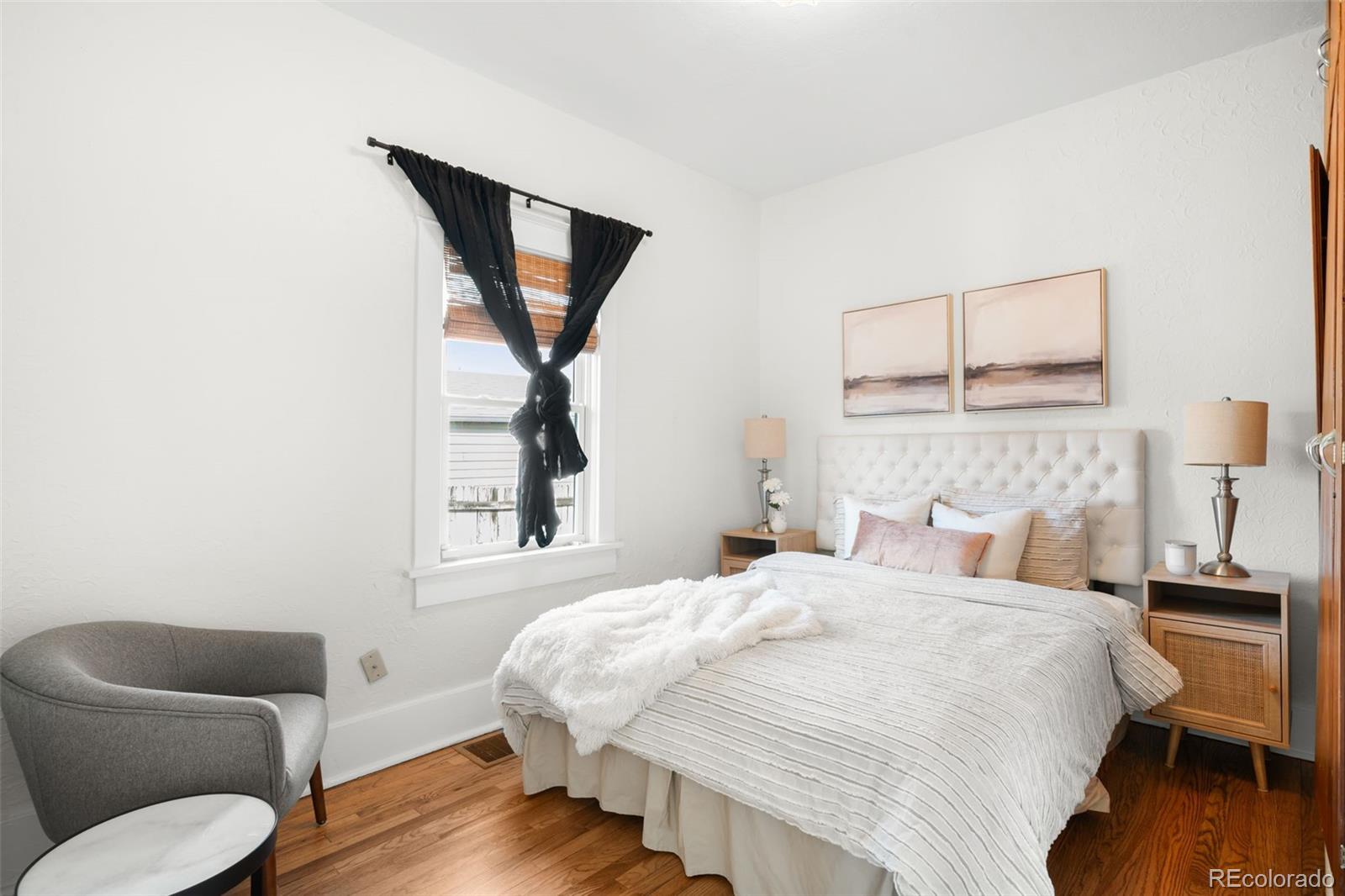 1032 Hooker Street Denver, CO 80204 - Photo 11 of 31 a bedroom with a bed and a couch