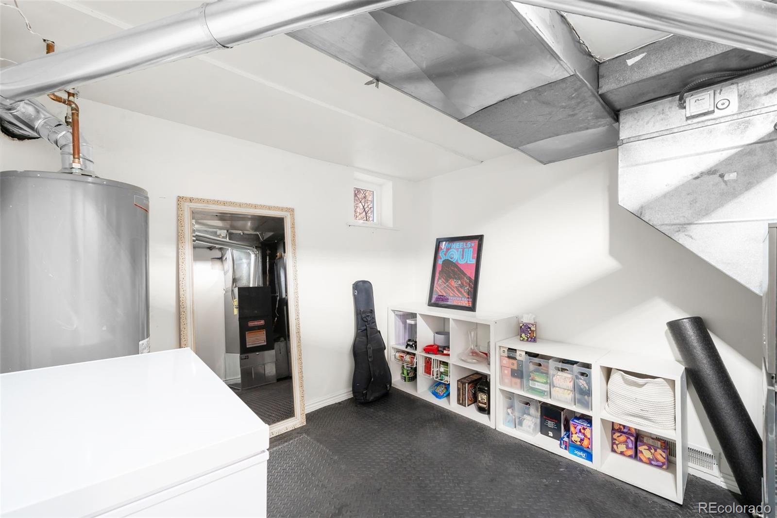 1032 Hooker Street Denver, CO 80204 - Photo 15 of 31 a bed room with a bed