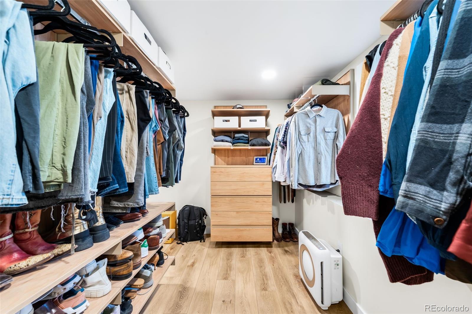 1032 Hooker Street Denver, CO 80204 - Photo 18 of 31 a view of walk in closet with clothes and shoes