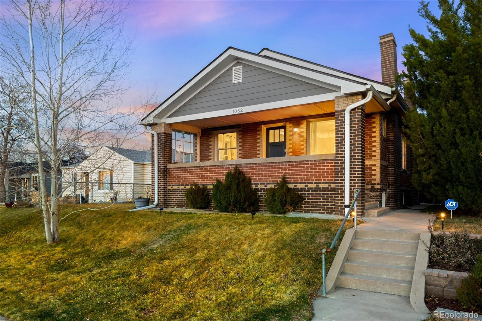 1032 Hooker Street Denver, CO 80204 - Photo 2 of 31 a front view of a house with a yard