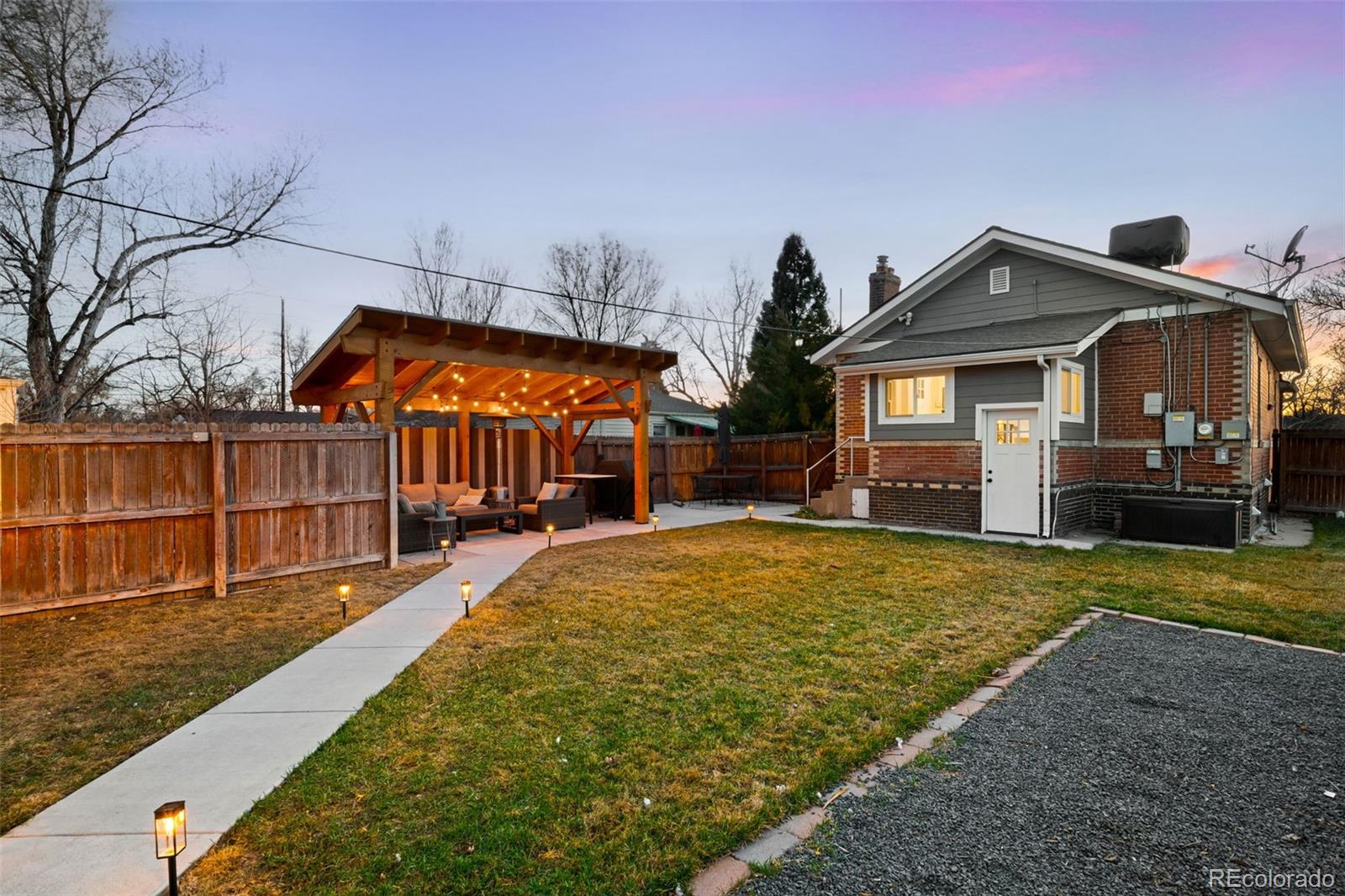 1032 Hooker Street Denver, CO 80204 - Photo 21 of 31 a front view of a house with a yard