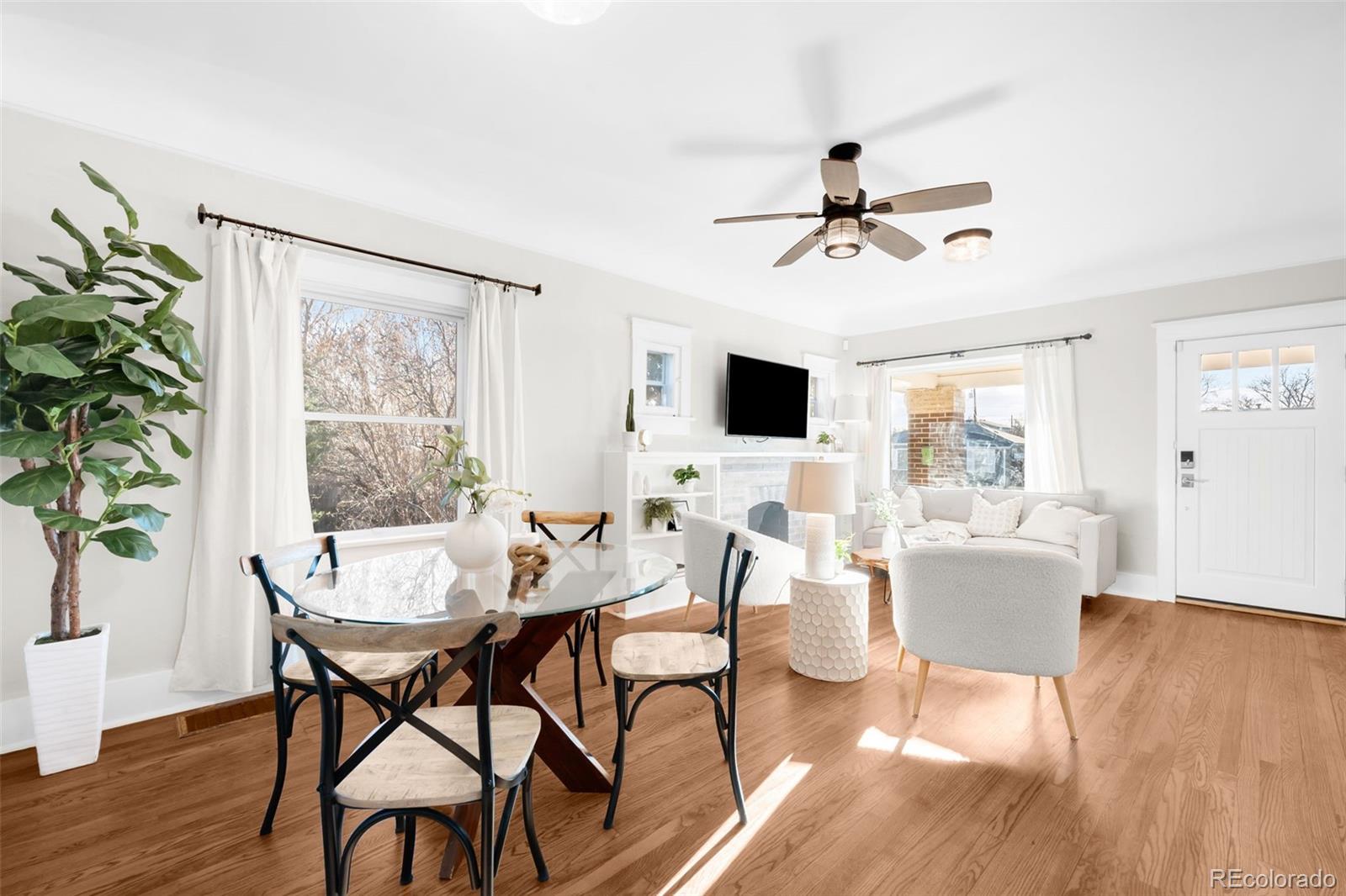 1032 Hooker Street Denver, CO 80204 - Photo 6 of 31 a view of a dining room with furniture window and wooden floor