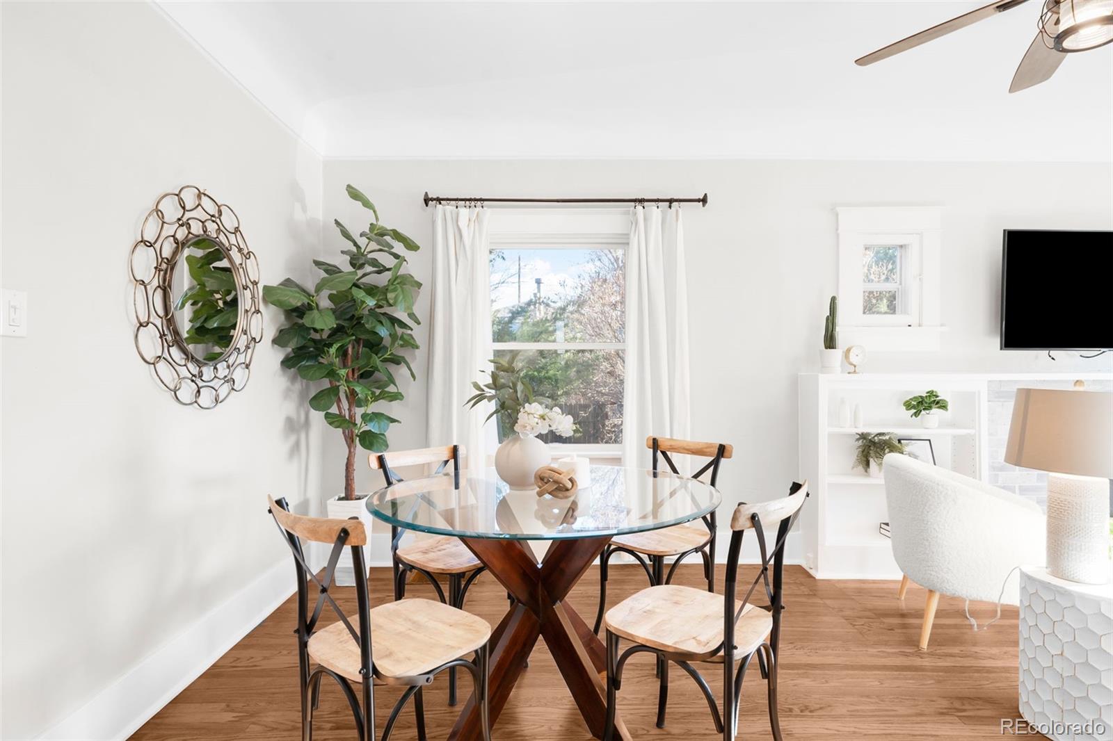 1032 Hooker Street Denver, CO 80204 - Photo 7 of 31 a view of a dining room with furniture and wooden floor