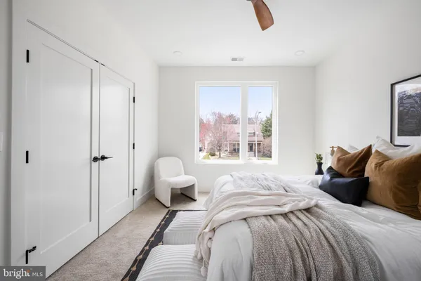 a bedroom with bed and a window